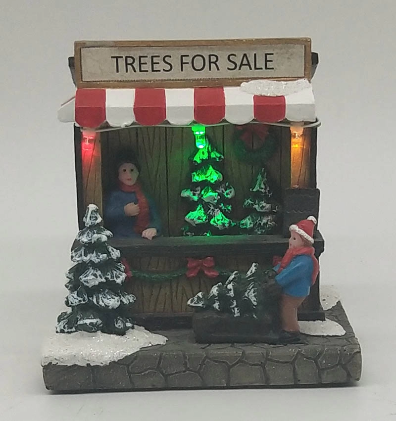 Boutique de guirlandes de Noël illuminées avec un homme