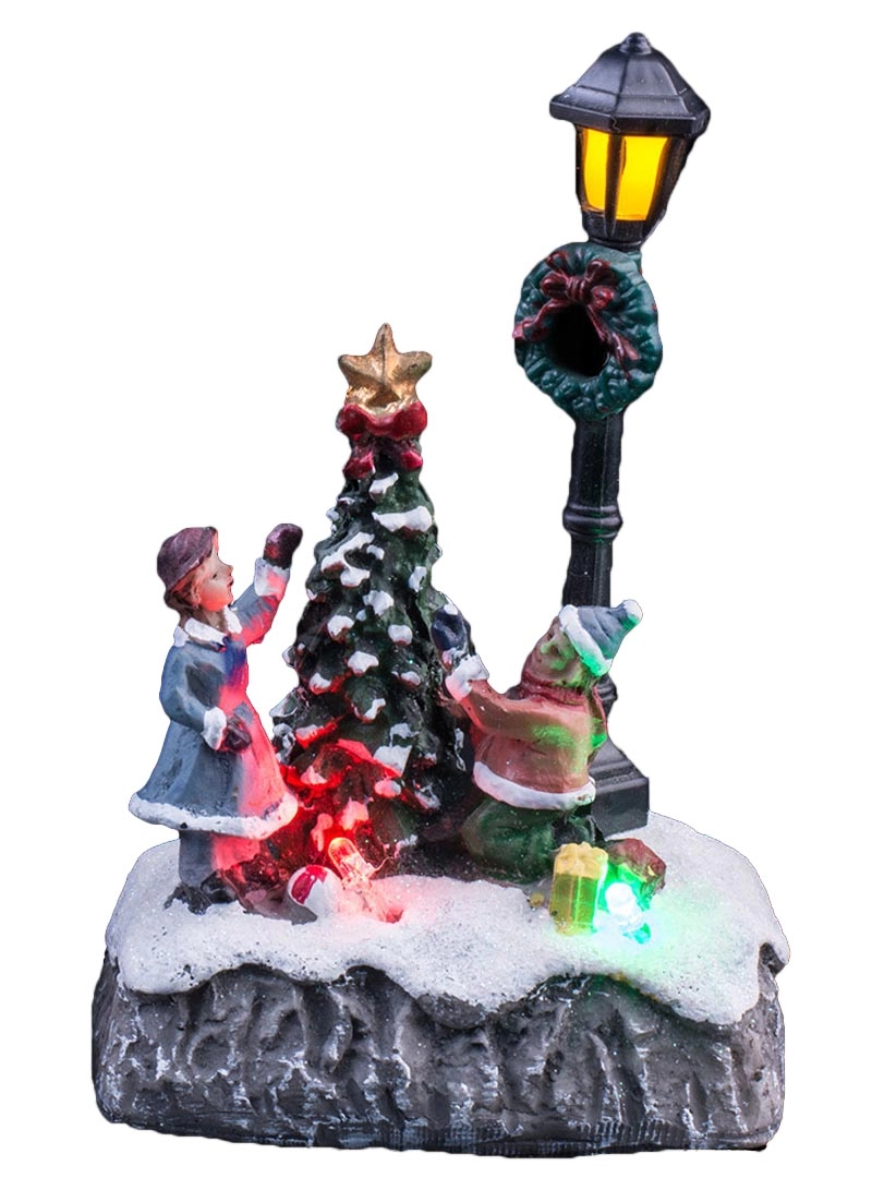 Scène de Noël illuminée avec des enfants décorant le sapin de Noël