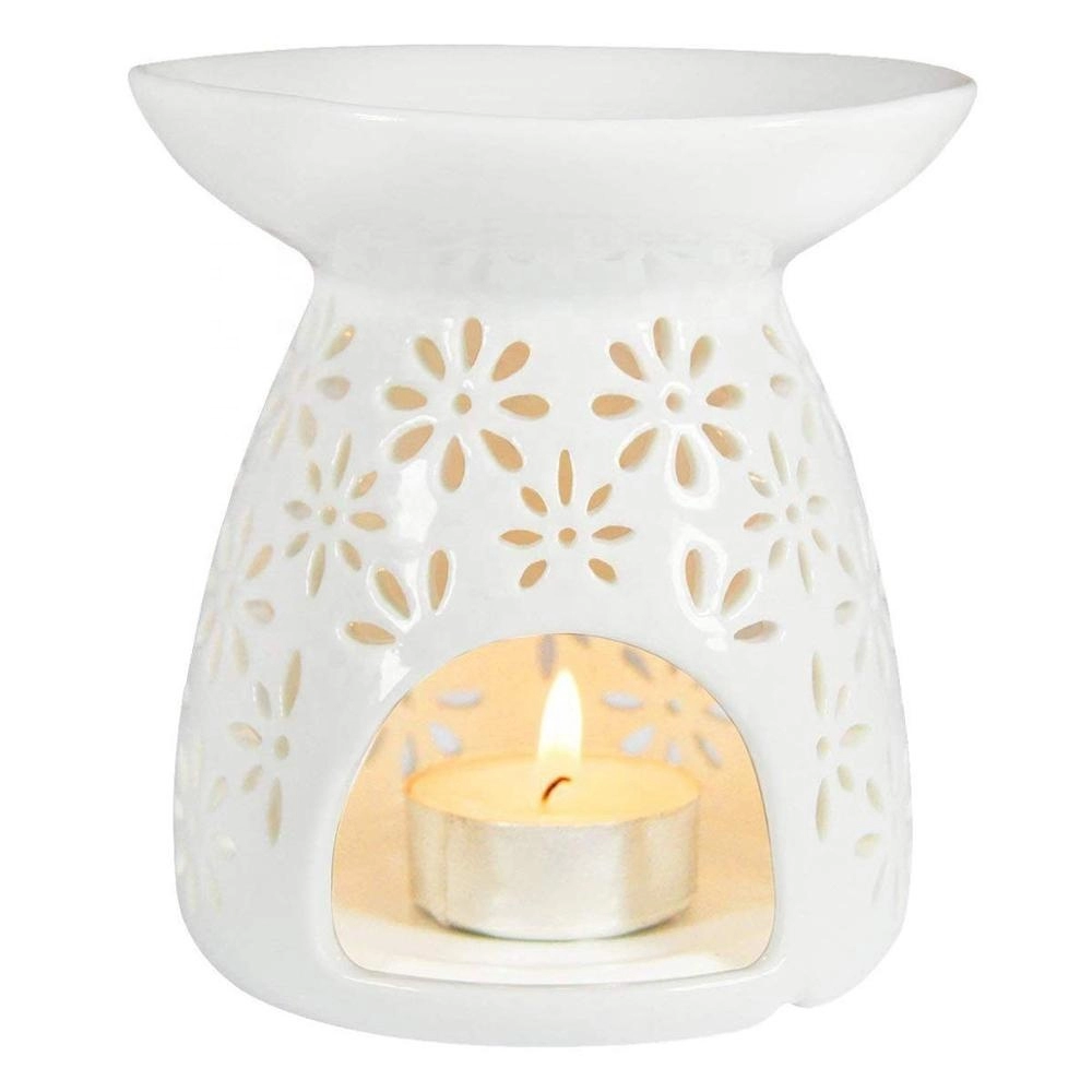 Vase en forme de lait blanc en céramique évidant l'arôme floral chauffe-bougie brûleur diffuseur d'huile