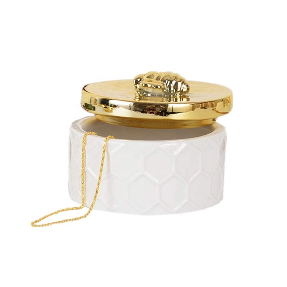 Boîte à bijoux en céramique faite à la main avec couvercle en forme d'abeille dorée