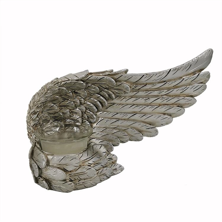 Bougeoir figurine aile d'ange en résine argentée